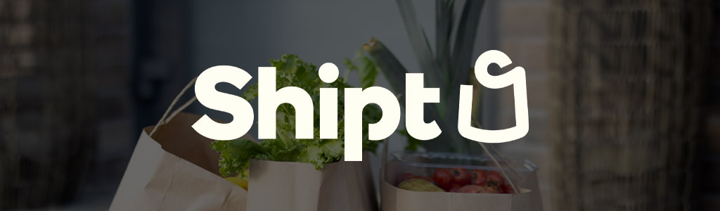 Shipt logo against a background of fresh groceries