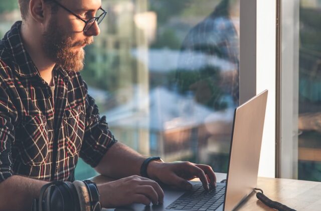 Gig worker annotating data on his laptop for TELUS Digital.