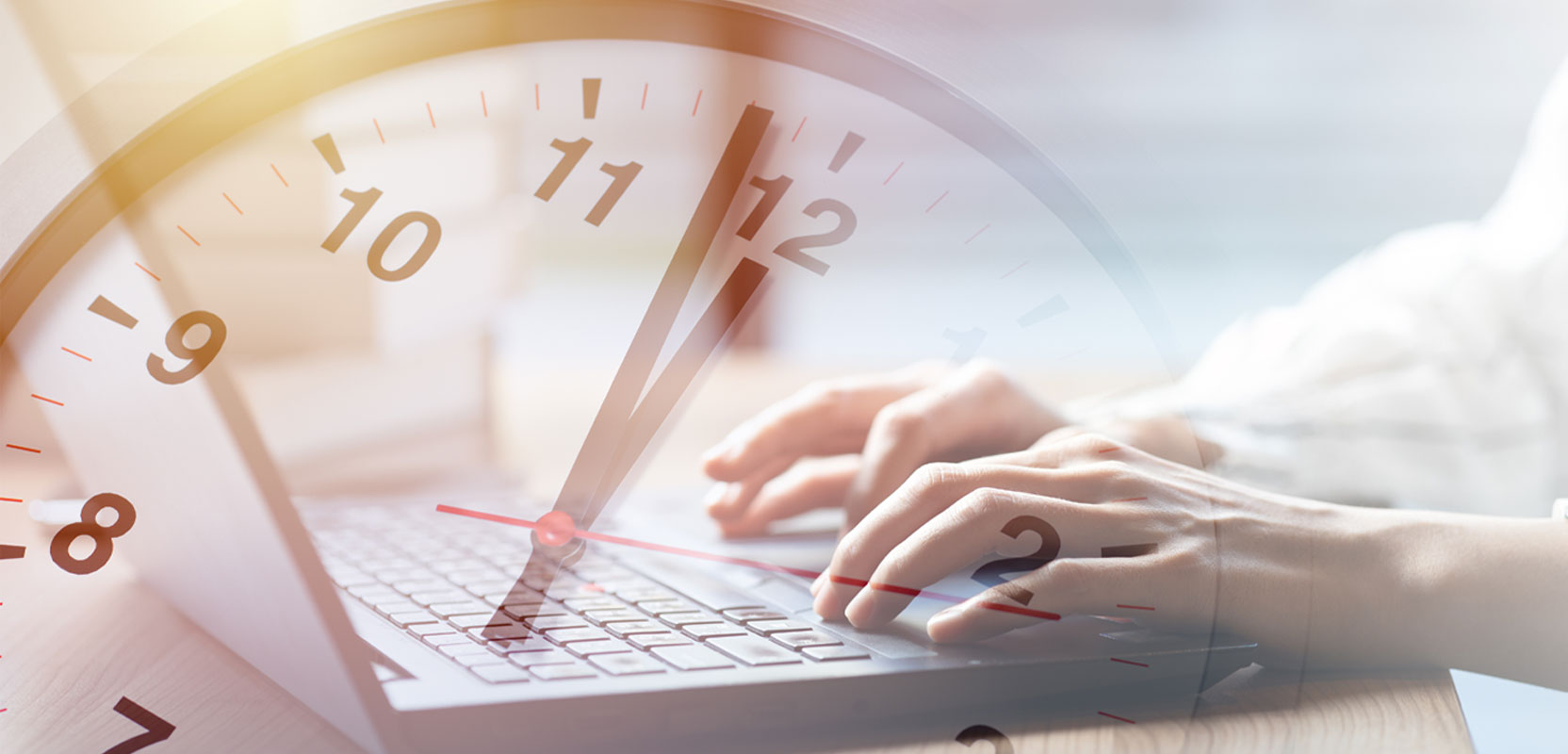 Person typing on a keyboard against a background showing a ticking clock