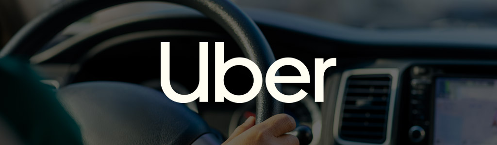 Uber logo against the background of the interior of a car