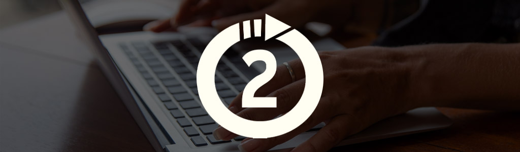 Up2Staff logo against a darkened background showing a freelancer's hands typing on a laptop
