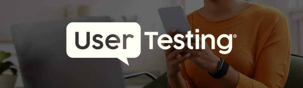 User Testing logo against a background of someone working on their mobile phone