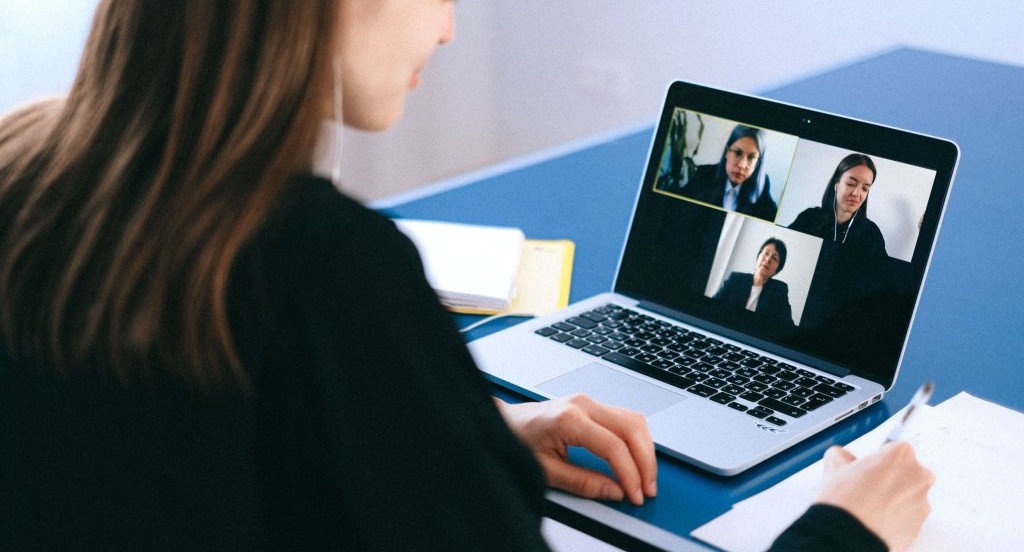 Freelance video editor interviewing for a contract with clients.