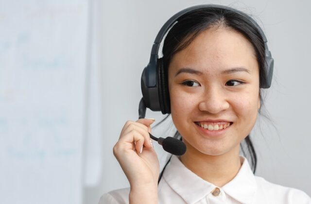 Virtual assistant taking a call on a headset.