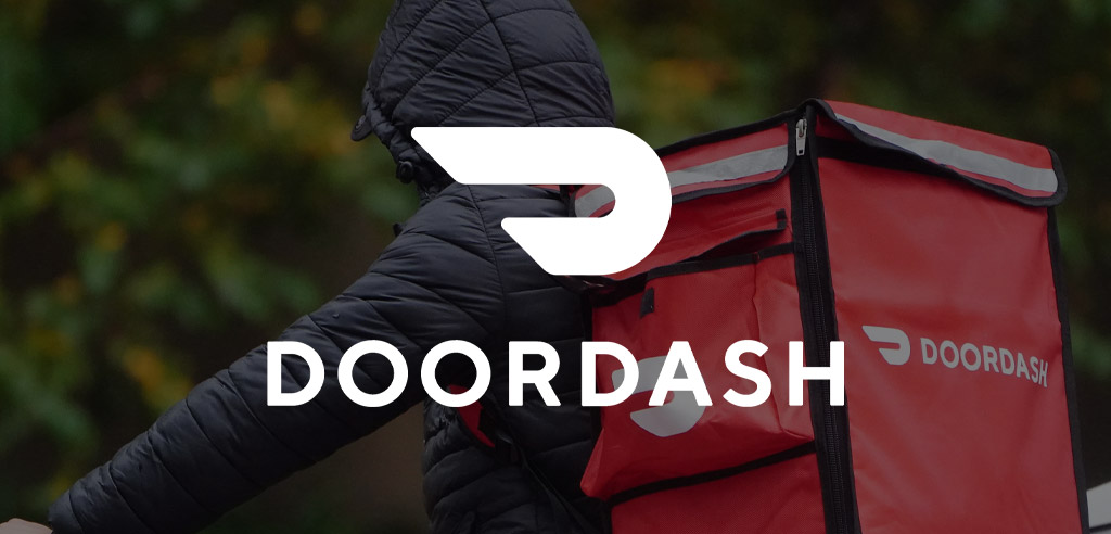 DoorDash logo against a slightly darkened background showing a Dasher on a delivery