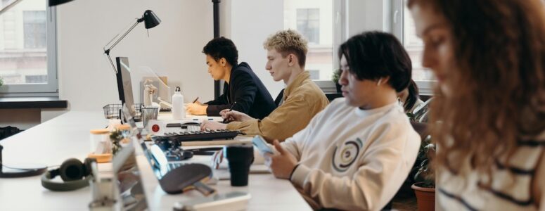 Four employees working in an office.
