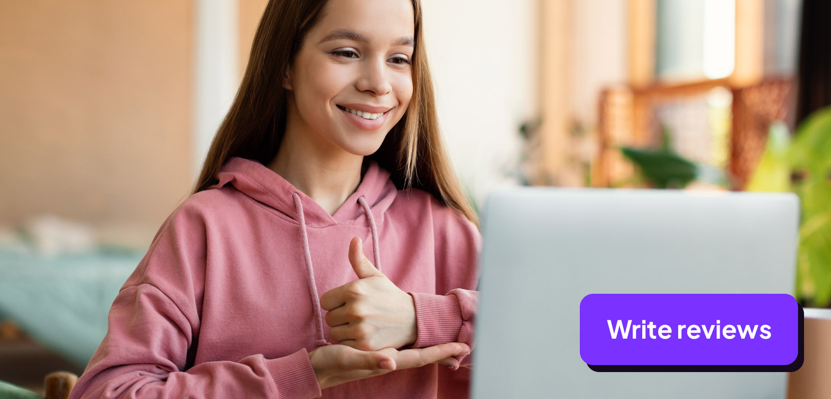 Teenage freelancer giving a thumbs-up sign to her laptop representing reviewing a product