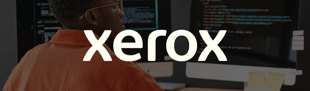 Xerox logo against a darkened background showing a freelancer looking at a screen