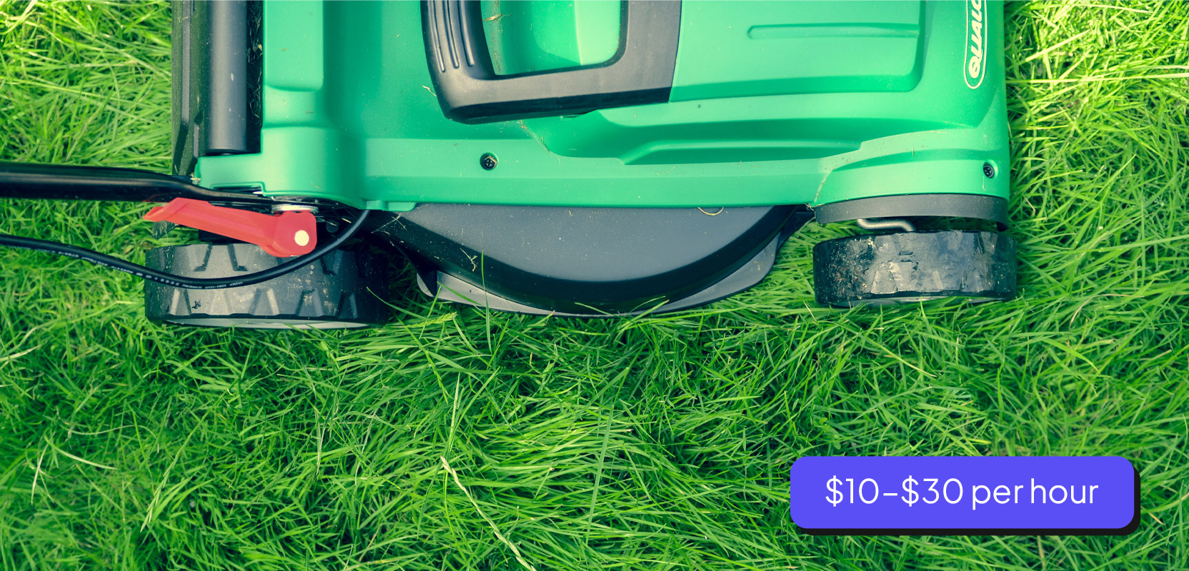 Lawnmower sitting on a grassy lawn